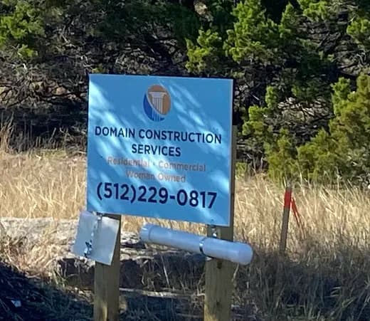 Domain Construction Services job sign at the property during early site work