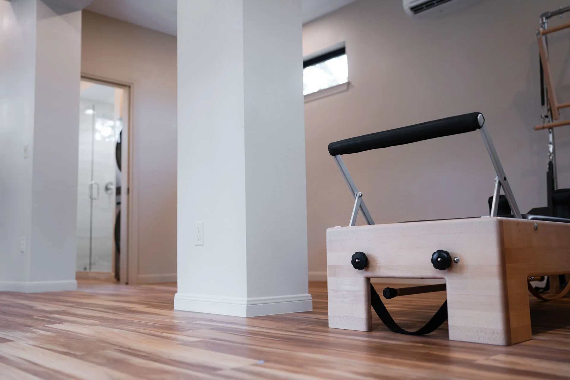 Pilates equipment and wood flooring in Domain’s Tan Container ADU