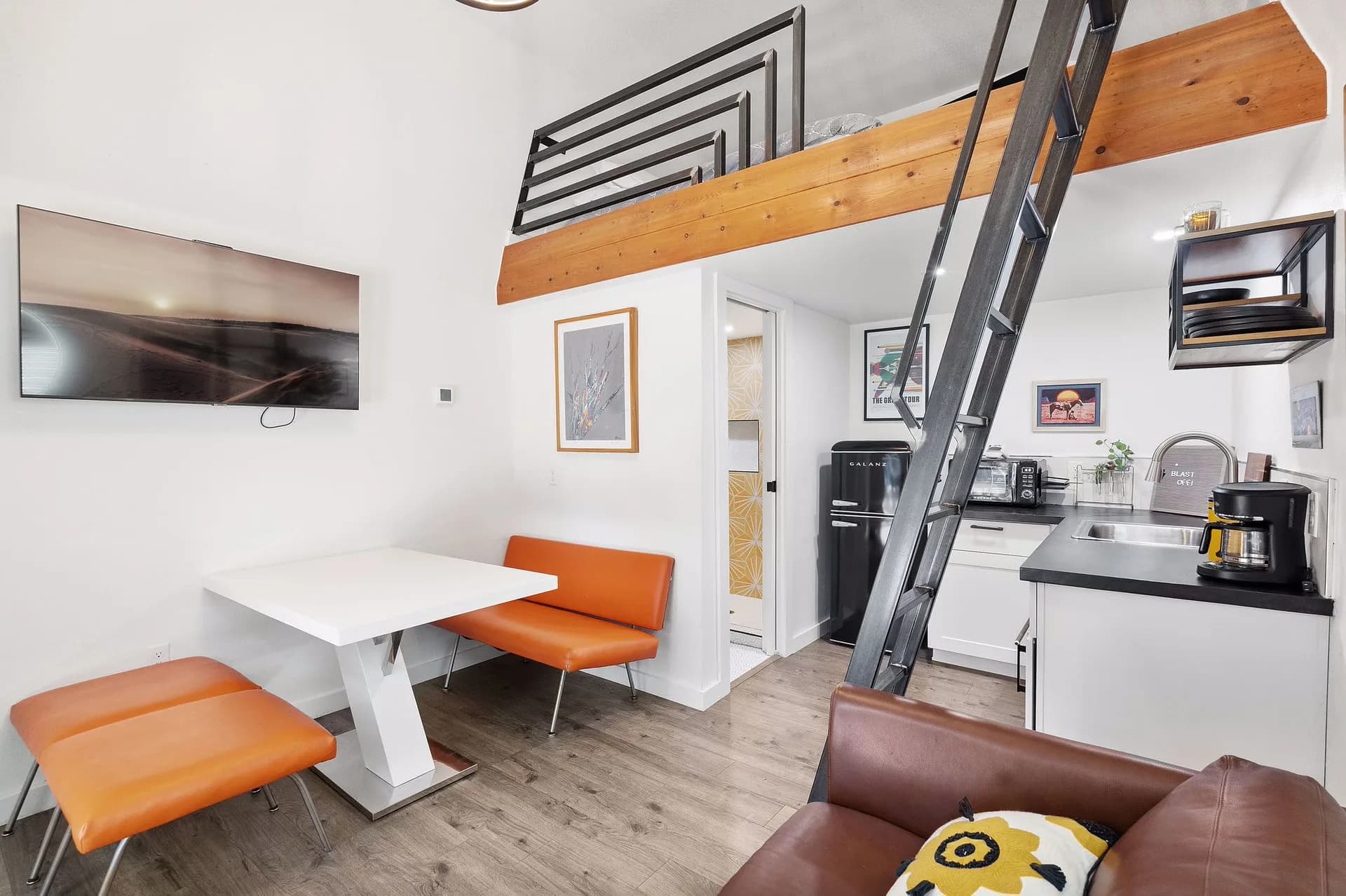 Compact kitchenette, dining space, and loft in Domain’s East Austin Tuff Shed ADU